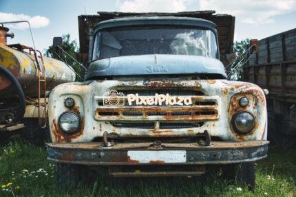 Front View of Rusty Soviet ZIL 130 Truck - Abandoned Vintage Vehicle in Countryside